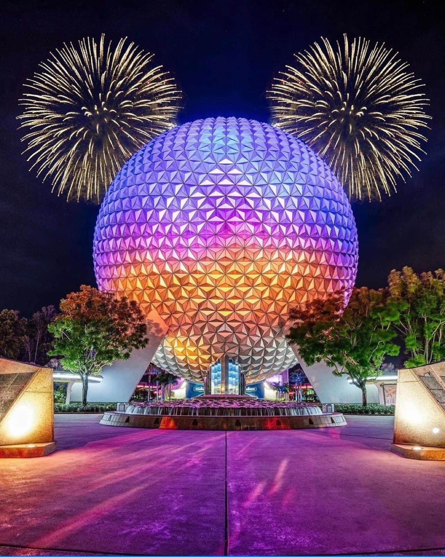 EPCOT’s Spaceship Earth illuminated during fireworks
